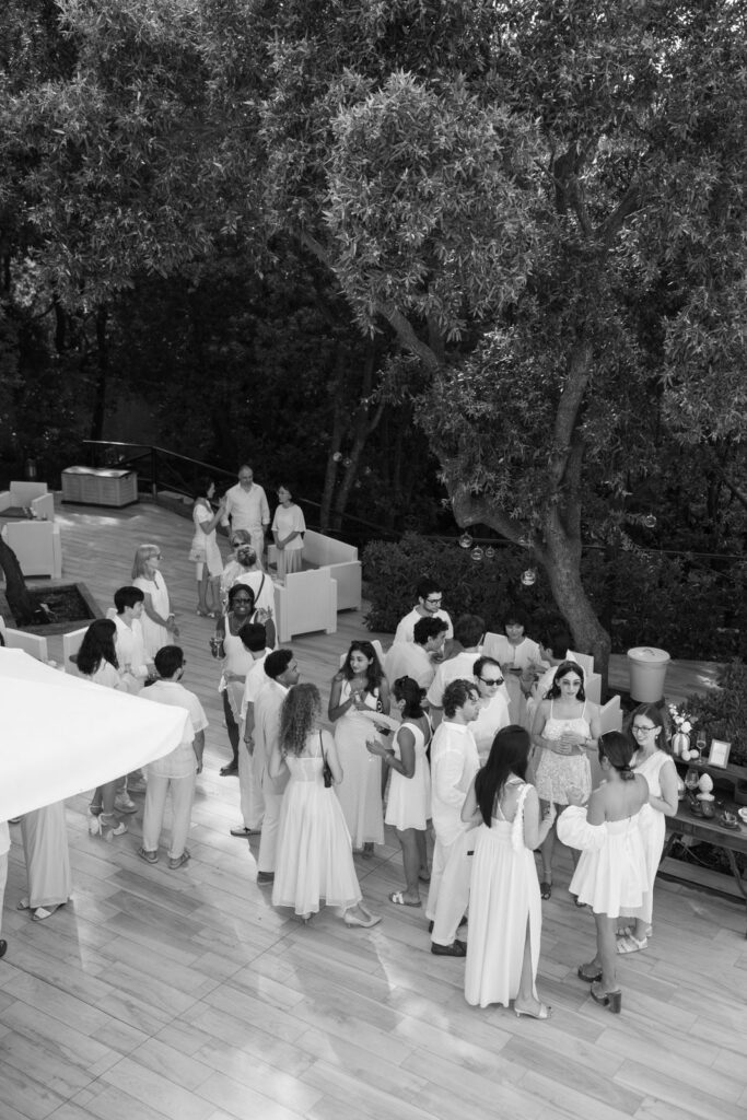 Guests mingle at the welcome pool party